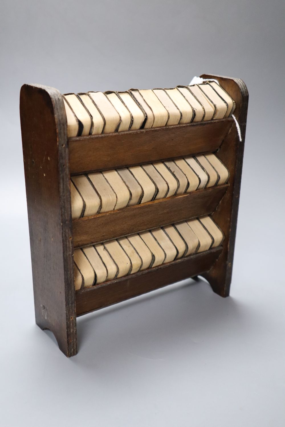 Shakespeares Works in miniature, 40 volumes on original three-shelf open bookcase, 20cm wide